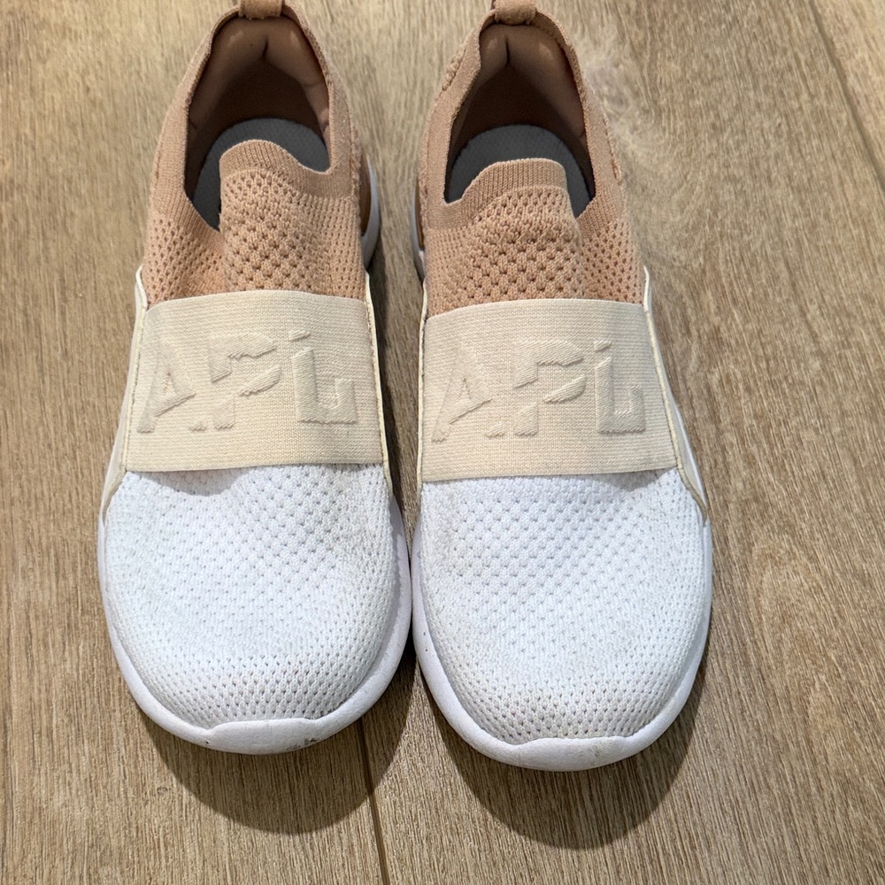 APL Cream and White Slip-On Shoes